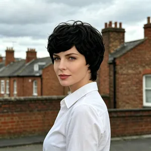 Detailed look at a short black curly pixie cut wig showing natural hair texture.
