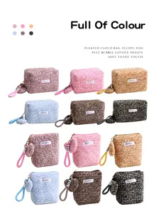 Variety of leopard print plush cosmetic bags in multiple colors and shapes with heart charms.