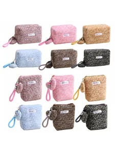 Collection of leopard print plush cosmetic bags featuring heart charms in various colors