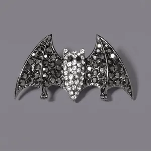 Gothic bat-shaped hair claw with sparkling black and white rhinestones for Halloween.