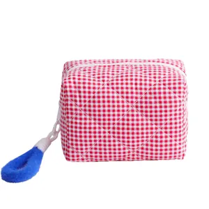 Trousse de maquillage matelassée à carreaux rouge et blanc avec tirette bleue pour voyage
