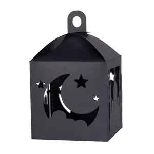 Black laser-cut paper lantern with star and moon patterns for Ramadan party atmosphere