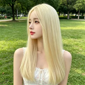 Long straight platinum blonde wig shown on a model in a natural outdoor park setting.