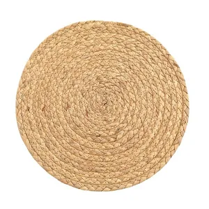 Hand-woven round straw placemat with natural corn husk texture for dining heat insulation