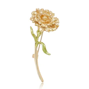 Elegant gold carnation brooch pin featuring green enamel leaves for women's suit jackets