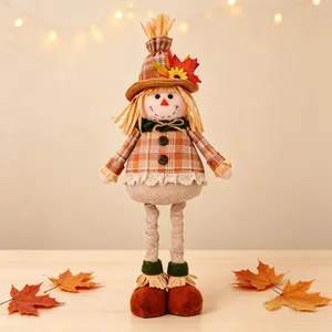 Close-up of harvest festival scarecrow doll with extensible legs and autumn leaf hat