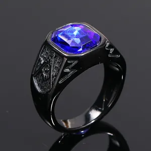 Close-up view of black titanium ring with a large blue gemstone and Masonic engraving