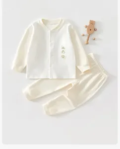 Detailed view of a soft cream-colored baby cotton underwear set with cute embroidery