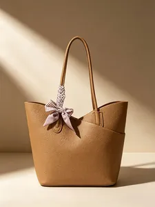 Elegant brown high-capacity minimalist tote bag with decorative patterned silk scarf