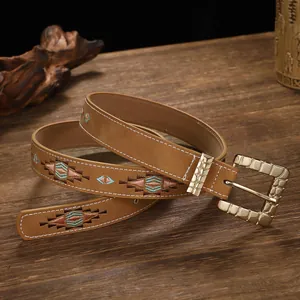 Vintage ethnic embroidered belt with geometric rhombus patterns and gold buckle.