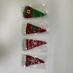 Detail of four festive Christmas non-woven cutlery holders in various embroidery designs