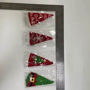 Close-up detail of festive Christmas cutlery holders with ruler for size reference