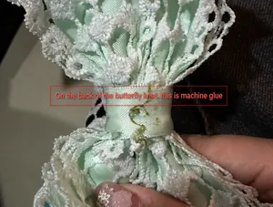 Macro detail showing the back side and texture of a mint green lace ribbon bow accessory