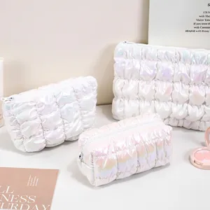 Iridescent holographic quilted puff cosmetic bags in various sizes for makeup storage