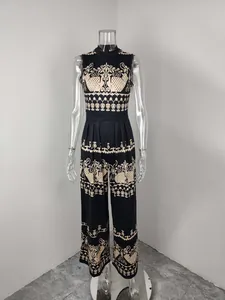 Front view of black sleeveless jumpsuit with vintage ethnic prints on a mannequin
