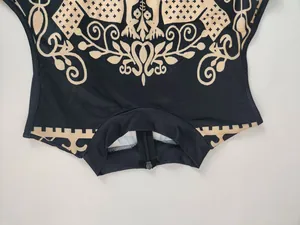 Close-up detail shot of a sleeveless women's jumpsuit featuring a vintage baroque print.