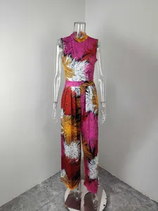 Vibrant abstract floral print sleeveless wide-leg jumpsuit displayed on a clear mannequin