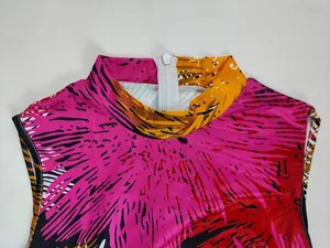 Detail of high neck and back zipper on vibrant printed sleeveless jumpsuit for women