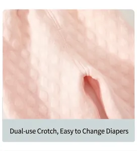 Close-up detail of the dual-purpose crotch on pink quilted baby thermal pants for easy changing