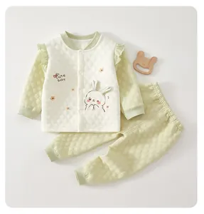 Detailed view of baby thermal underwear set with cute rabbit pattern and quilted fabric.