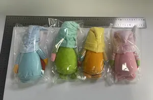 Detailed view of four colorful faceless Easter bunny gnomes with a size scale ruler