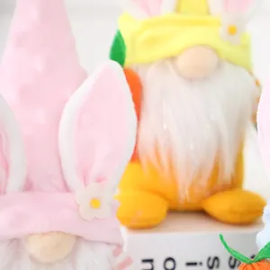 Close-up of cute Easter faceless bunny gnomes plush decor for home table