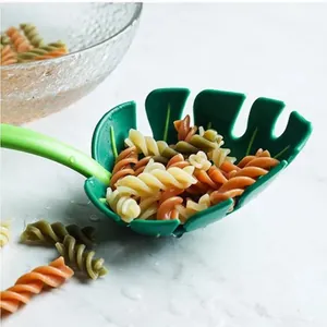 Creative green monstera leaf shaped pasta server spoon and colander for kitchen use