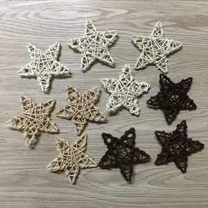 Detailed view of 9cm rattan woven stars in three natural colors for Christmas decor
