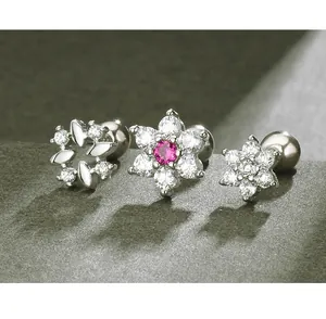 Macro close-up of s925 silver flower stud earrings with sparkling clear cubic zirconia