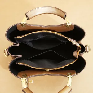 Top view of large capacity bronze tote bag showing organized interior and compartments