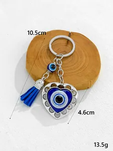 Detail of blue evil eye heart keychain with tassel and 10.5cm size label