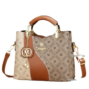 Fashionable brown patterned tote bag with gold-tone hardware and pearl charm details