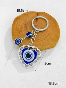 Detailed view of heart-shaped Evil Eye keychain with dimensions 13.8cm total length