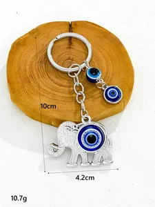 Detailed view of silver elephant evil eye keychain showing 10cm length and 10.7g weight