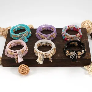Set di braccialetti di perline multistrato bohémien con nappe e ciondoli su legno