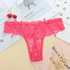 Detailed close-up showing the intricate floral lace and jacquard pattern of the pink thong