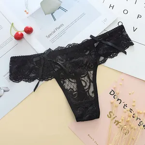 Elegant black floral lace thong for women featuring delicate bow details on the waist.