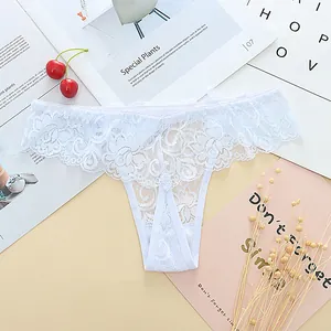 Close-up view of elegant white lace jacquard thong with intricate floral patterns