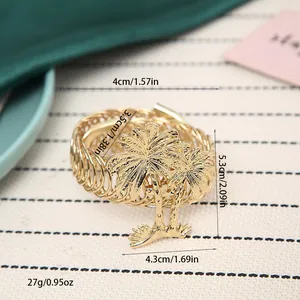 Detailed view of gold palm tree napkin ring with dimensions and weight measurements.
