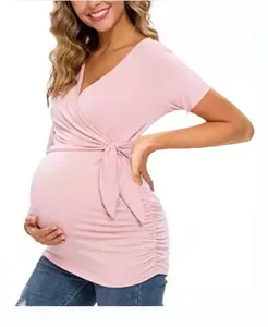 Detailed view of a soft pink wrap V-neck maternity nursing t-shirt for pregnant women