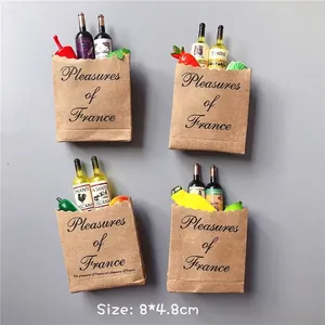 Close-up of 3D miniature grocery bag magnets with wine and fruit details