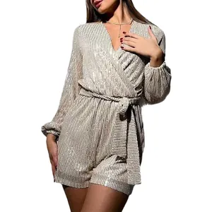 Shimmering champagne sequined long sleeve V-neck romper with an adjustable waist tie belt.