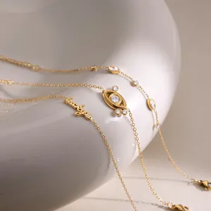 Macro view of 18K gold-plated Evil Eye and Lucky charm bracelets with sparkling zircons