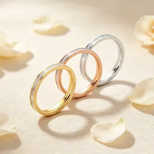 Detailed macro view showing three minimalist 2mm stainless steel rings with pearl inlay