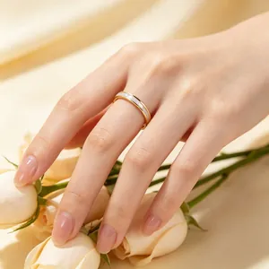 Close-up of a minimalist stainless steel ring featuring natural mother-of-pearl inlay