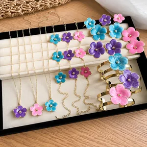 Chic enamel flower jewelry set including necklace, earrings, and bracelets for vacation
