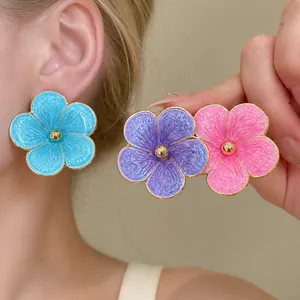 Vibrant flower stud earrings with colorful enamel finish in island vacation style.