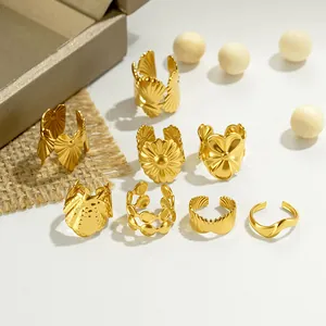 Collection of gold stainless steel no-piercing ear cuffs featuring heart and shell designs