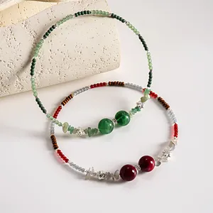 Detail of vintage beaded choker with acrylic glass beads and metal flower accents.