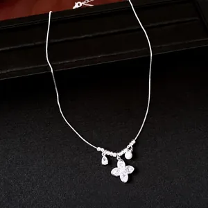 Elegant silver four-leaf clover necklace with zircon and pearl accents for women